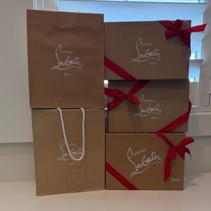 Christian Louboutin Brown Kraft Boxes and Bags with Red Ribbon Accents